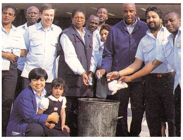 Jerry Yamoa and his colleagues at Nine Elms POst Office in 1998 - throwing away their inhalers after taking Yamoa Powder.